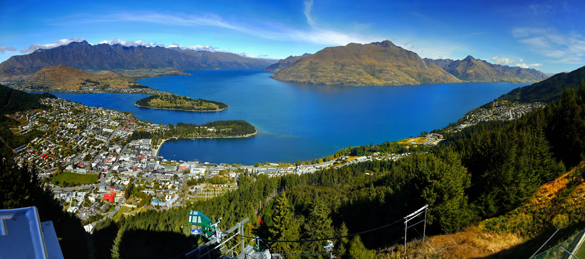 Queenstown and Lake Wakatipu from the hills above, with mountains across the water